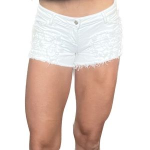 Distressed white Guess shorts